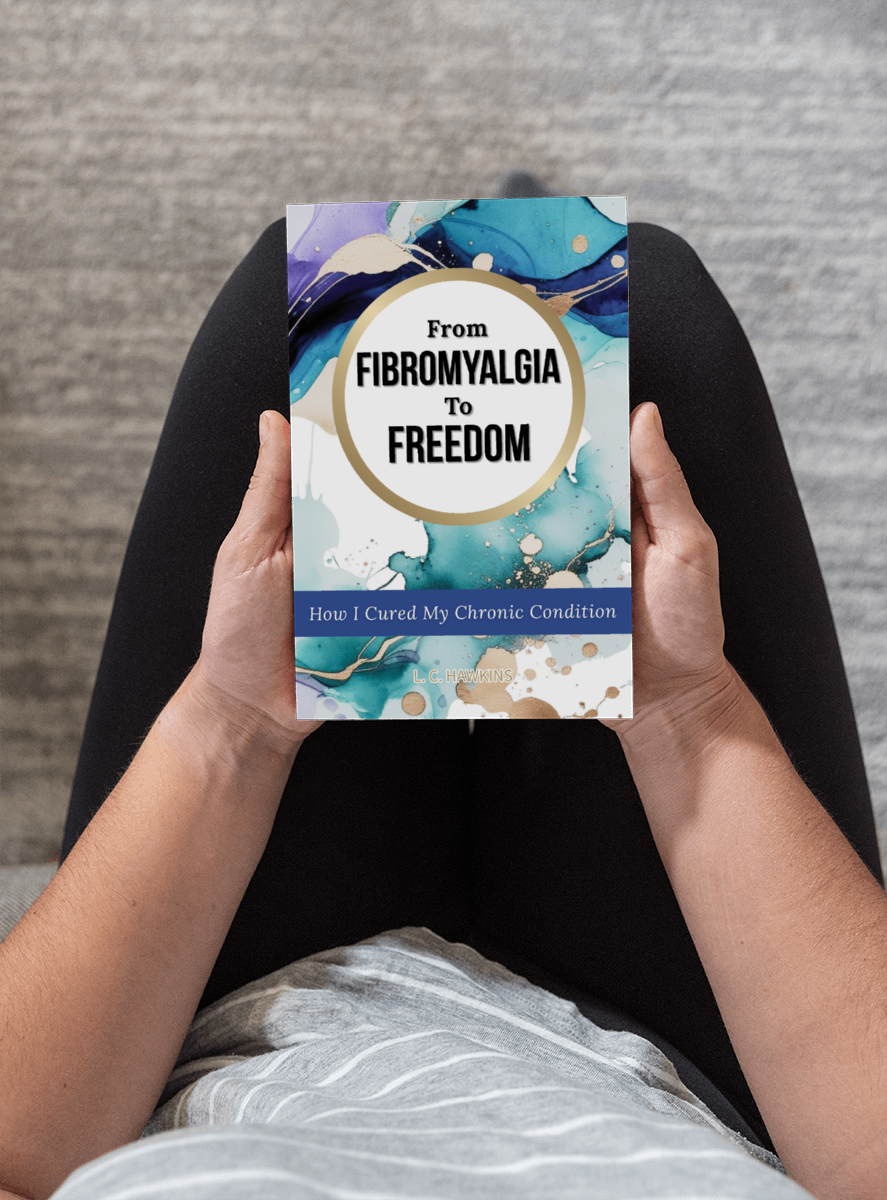 From Fibromyalgia to Freedom — book held in lap